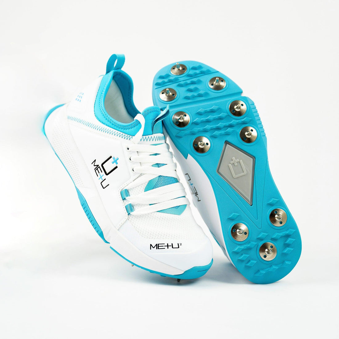 ME+U Mens All Rounder Cricket Shoes  heel raised and stud profilewith Blue Colours on white background