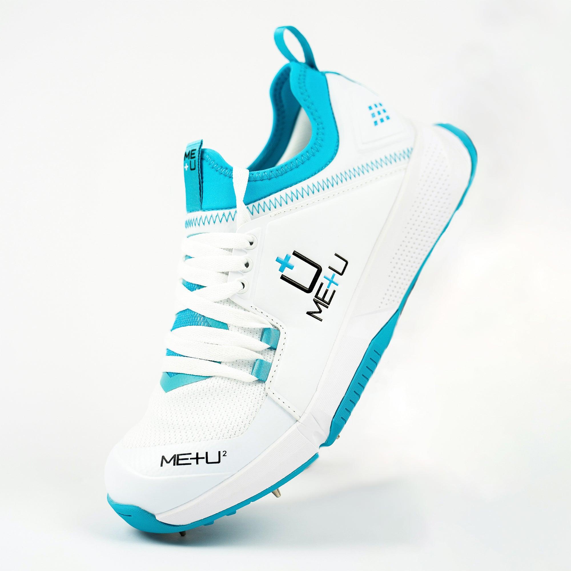 ME+U Mens All Rounder Cricket Shoes side profile - heel raised - with Blue Colours on white background